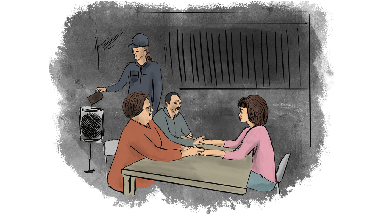 A female inmate receiving a visit from her family